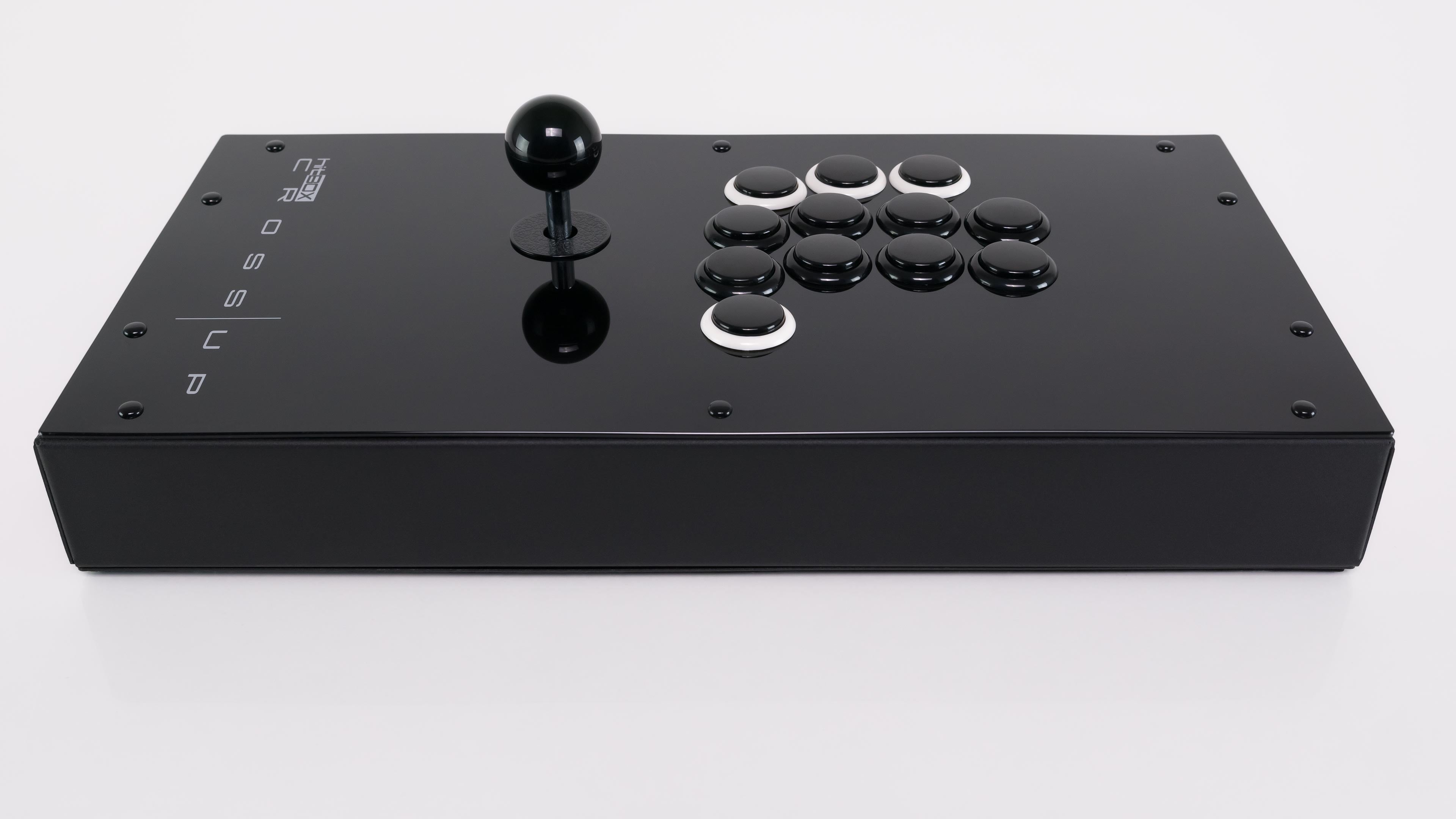 Hit Box Cross|Up in glossy black, shown from the front with its joystick, eight action buttons, and four white-rimmed directional buttons.